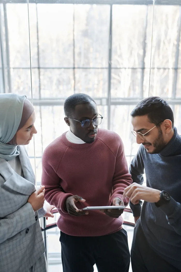 Diverse professionals collaborating during an advisory meeting